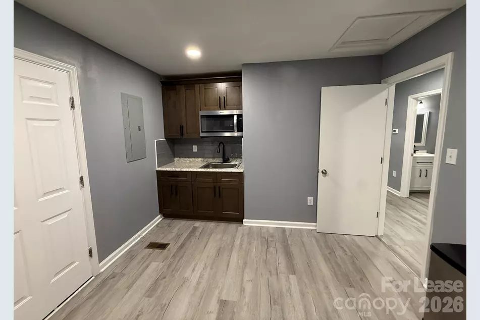 Shared tenant breakroom with kitchenette, sink and microwave at the Denver NC office suites