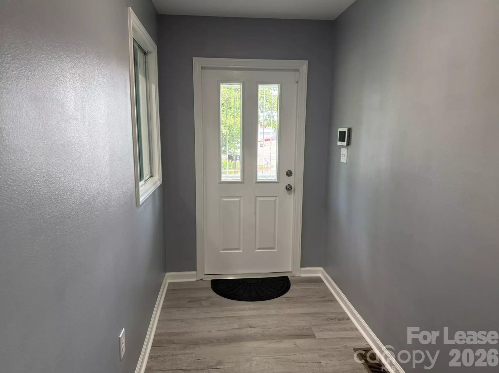 Entry hallway with front door and video intercom at the Denver NC office building